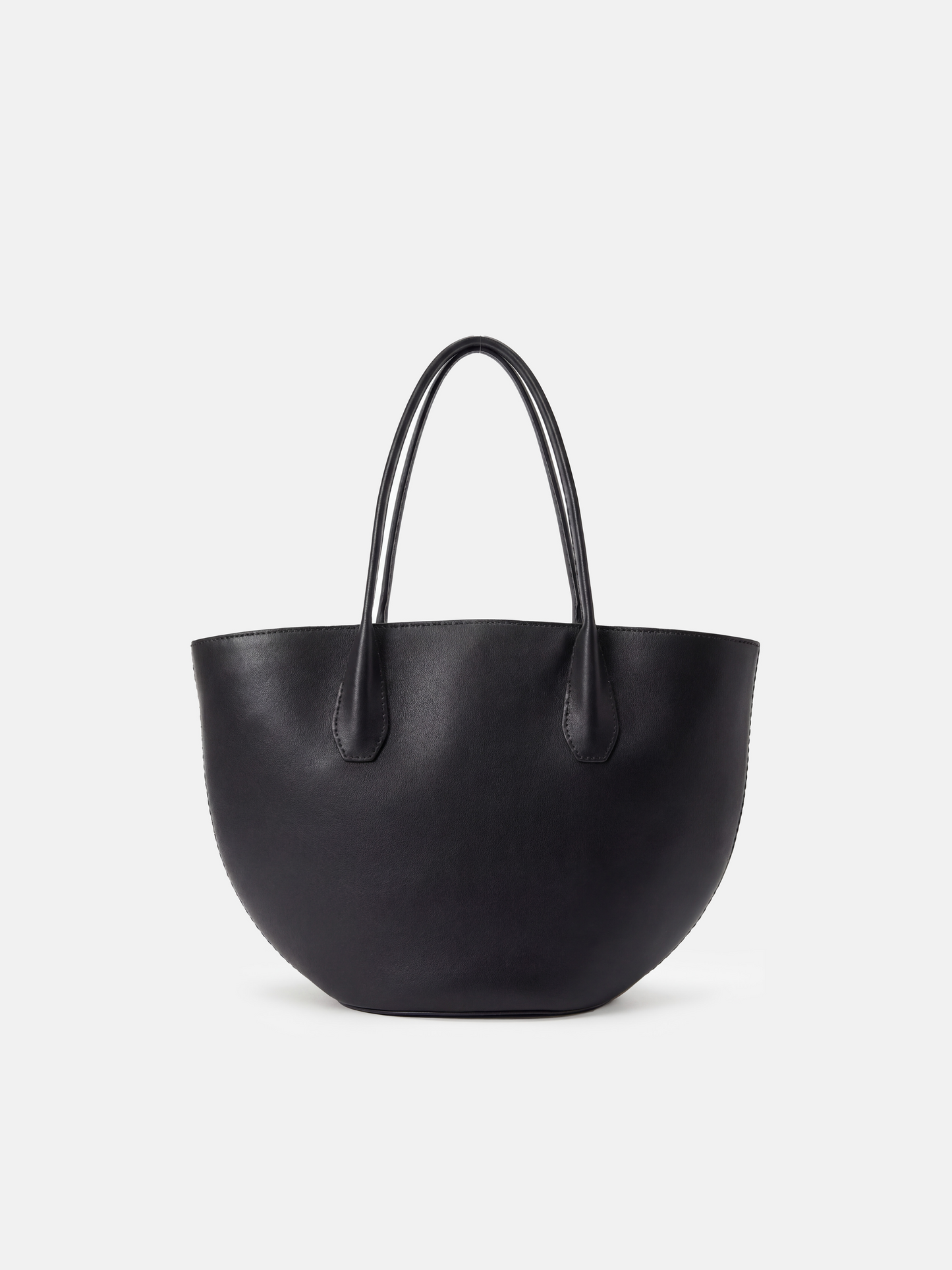 SELVANE Saddle Leather Crescent Tote Bag, featuring clean curvature, a grounded base, and long handles.