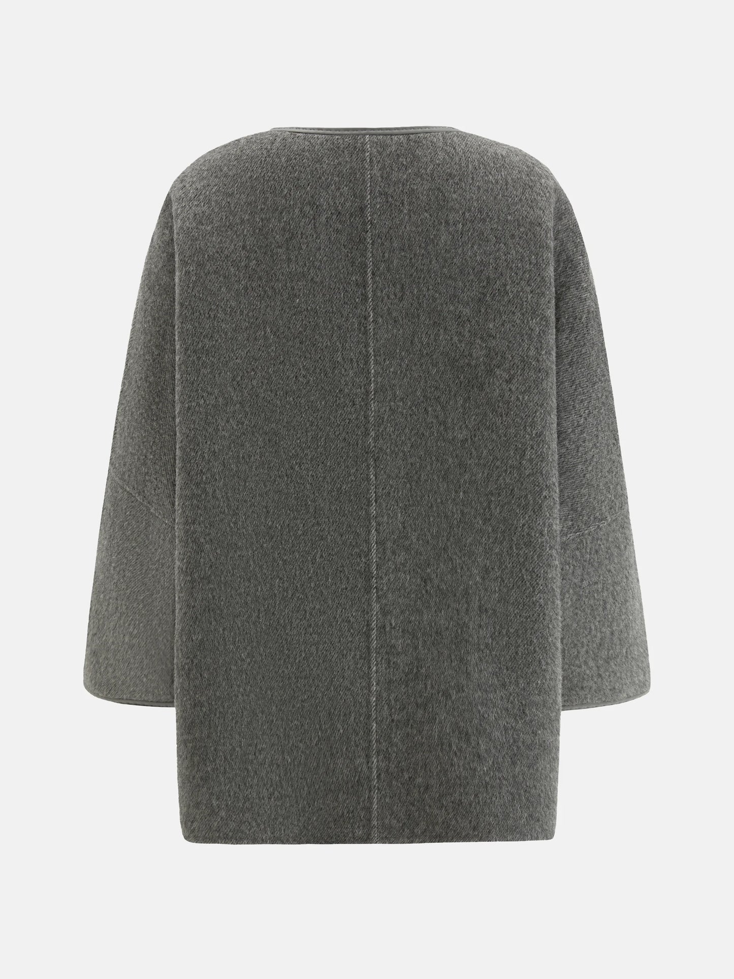 SELVANE asymmetric single-button wool coat in calm ivory, featuring a clear line and composed silhouette.