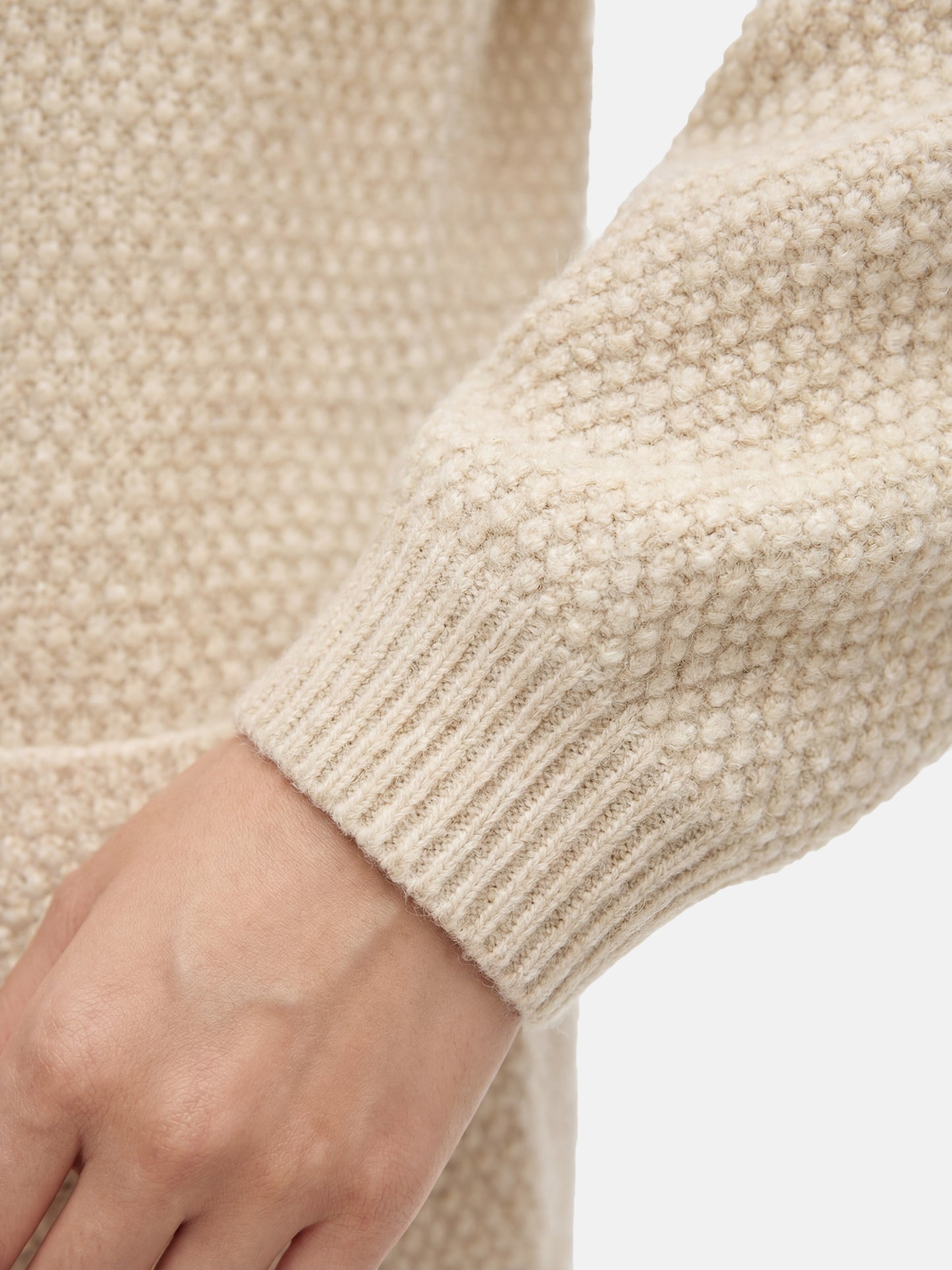 SELVANE Cashmere Textured Henley Sweater in a relaxed fit, featuring a clean round neck, subtle button placket, and visible pebbled texture, designed for calm daily wear.