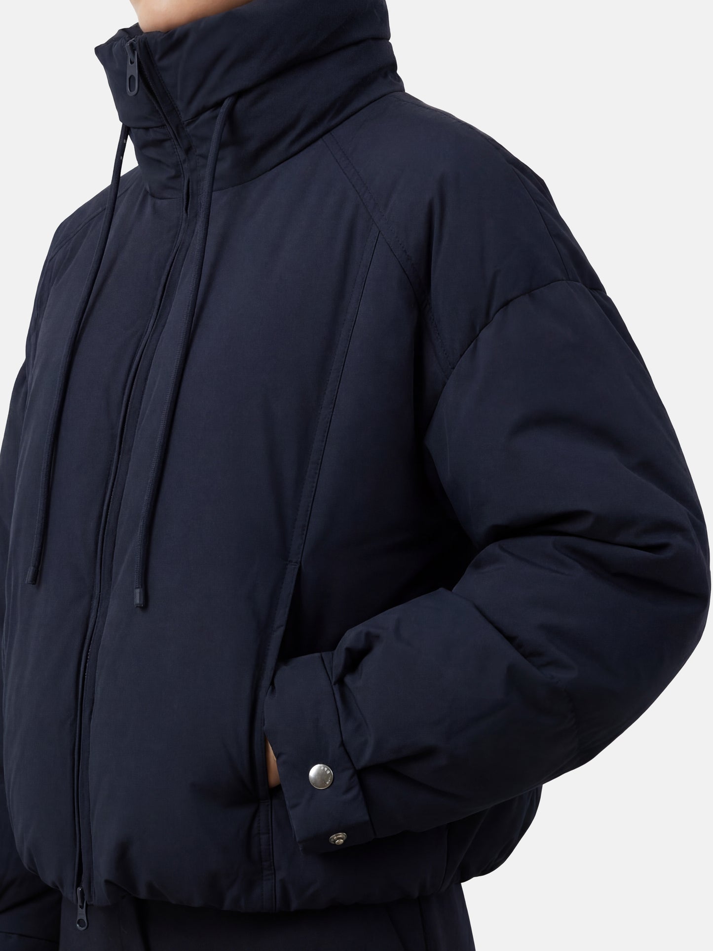SELVANE High-Neck Bomber Down Jacket in black, featuring an exaggerated high collar and rounded silhouette, refined matte finish.