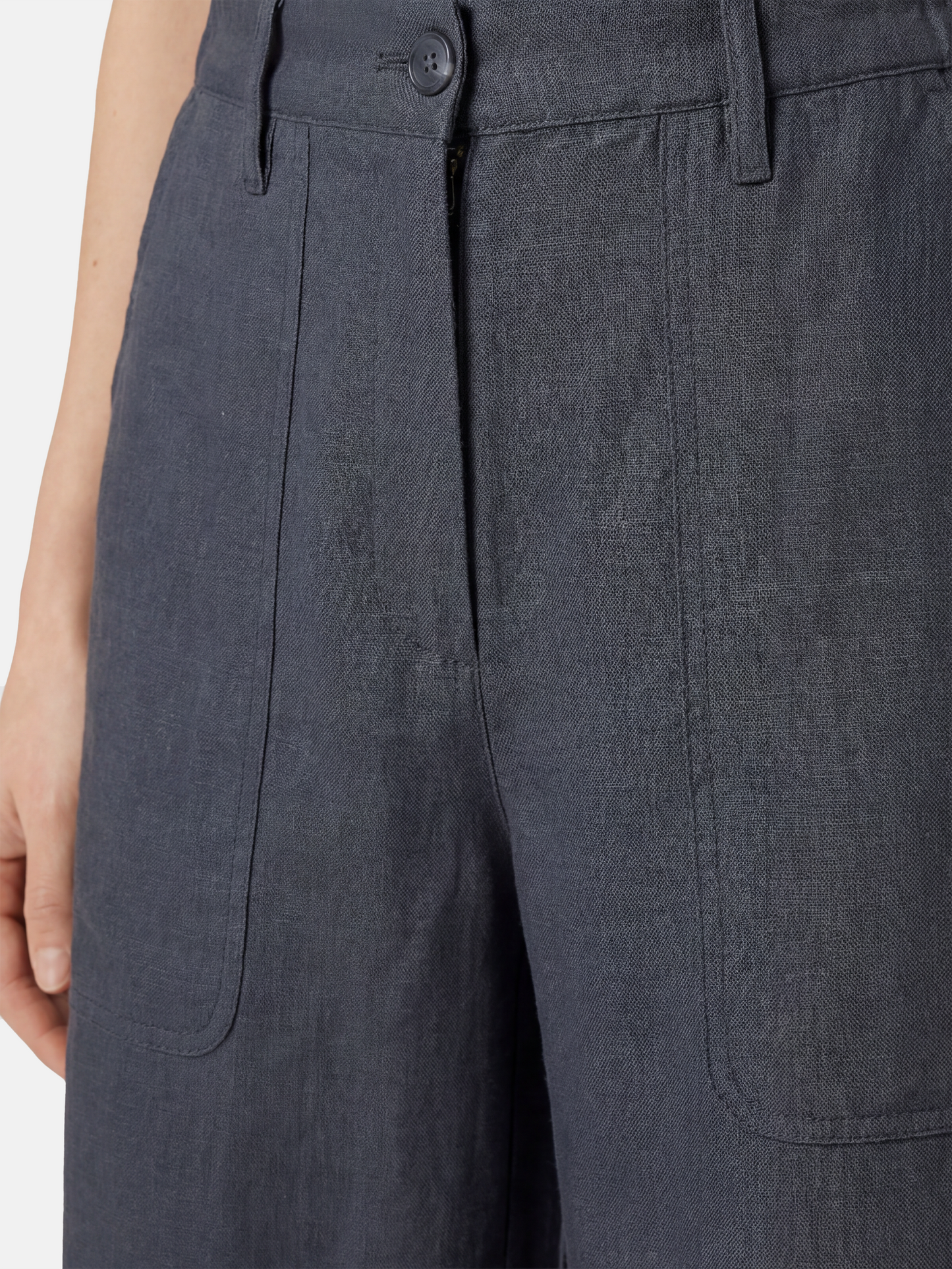 SELVANE Crisp Linen Work Pants, wide and straight cut, subtle utility pockets, on model, highlighting clear vertical lines and composed silhouette.