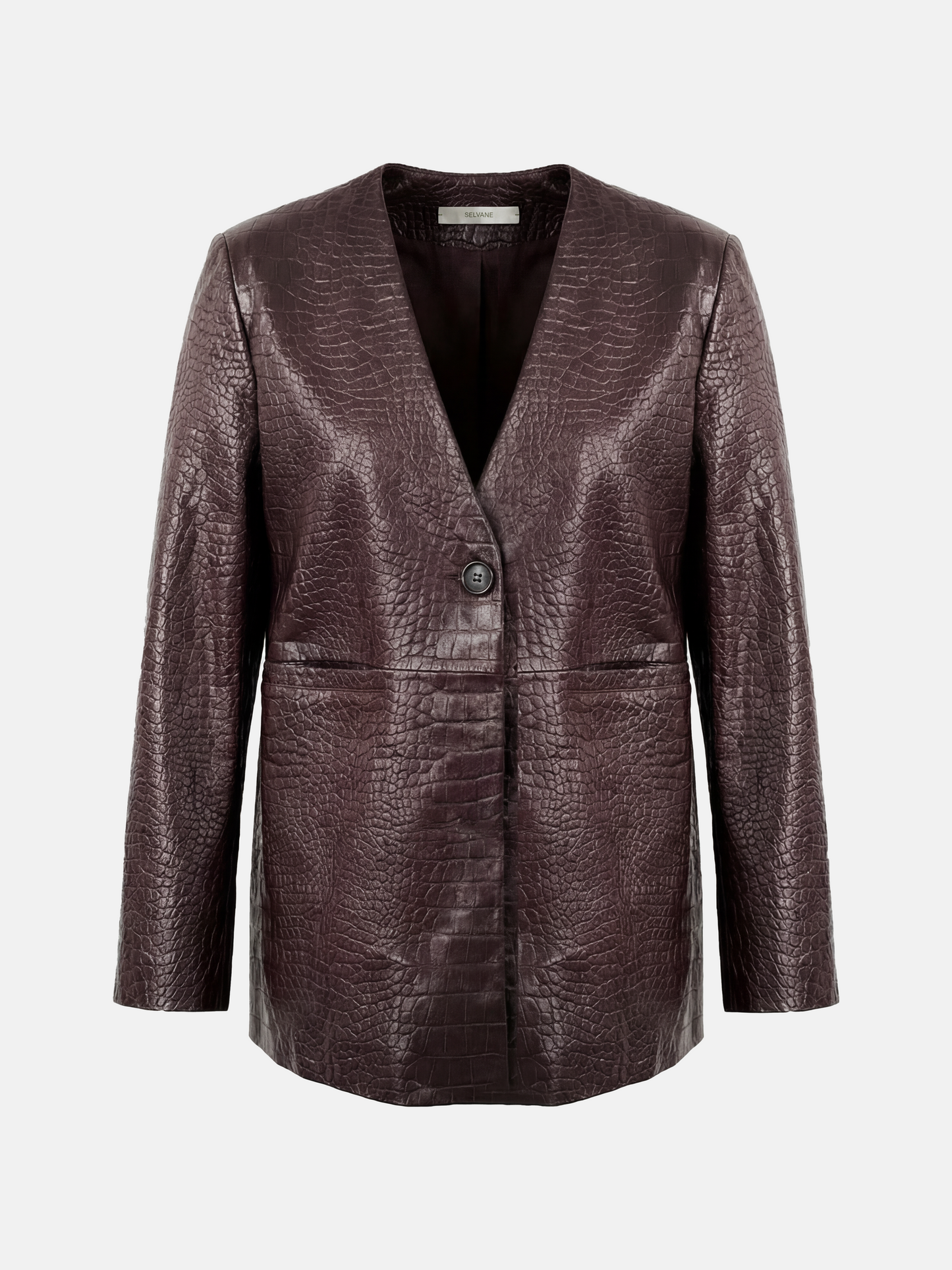 Deep oxblood embossed lambskin V-neck jacket, collarless with a single closure, shown on a model.