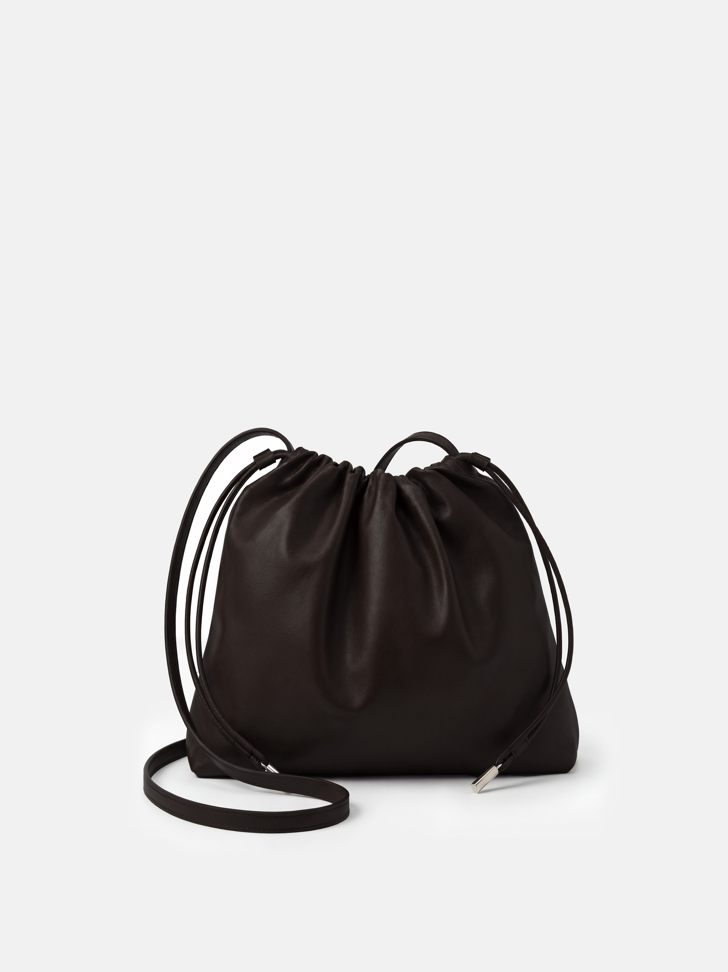 SELVANE soft drawstring pouch bag in a gentle, rounded silhouette with gathered top and secure strap.