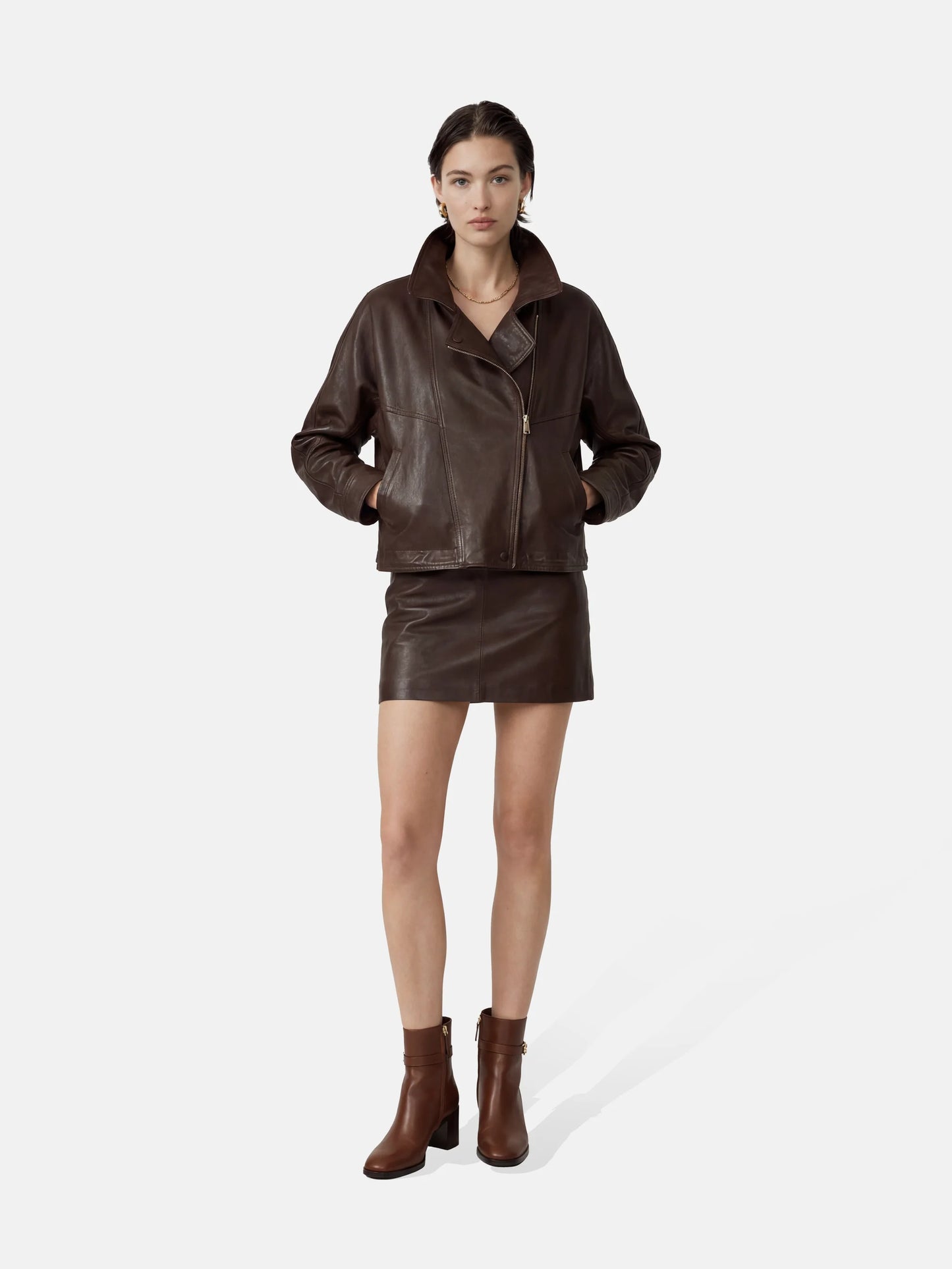 SELVANE Asymmetric Zip-Collar Lambskin Jacket in coffee-toned leather, showcasing its structural lines and urban elegance.
