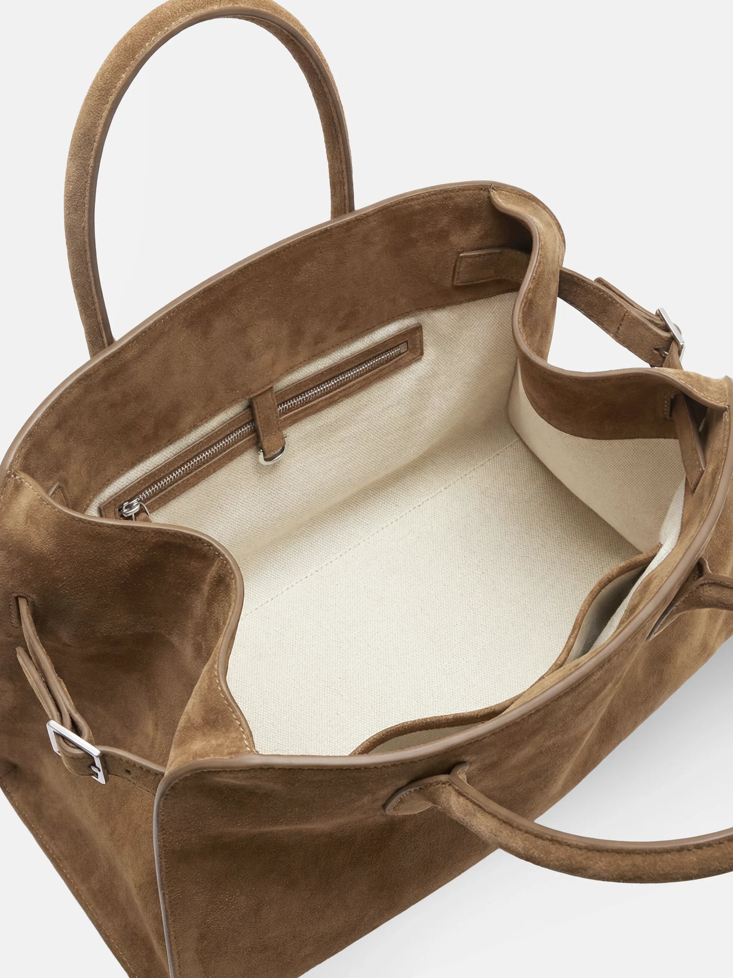 SELVANE Arched Suede Top-Handle Bag, featuring a domed silhouette and velvet-touch surface, presented on a minimalist background.