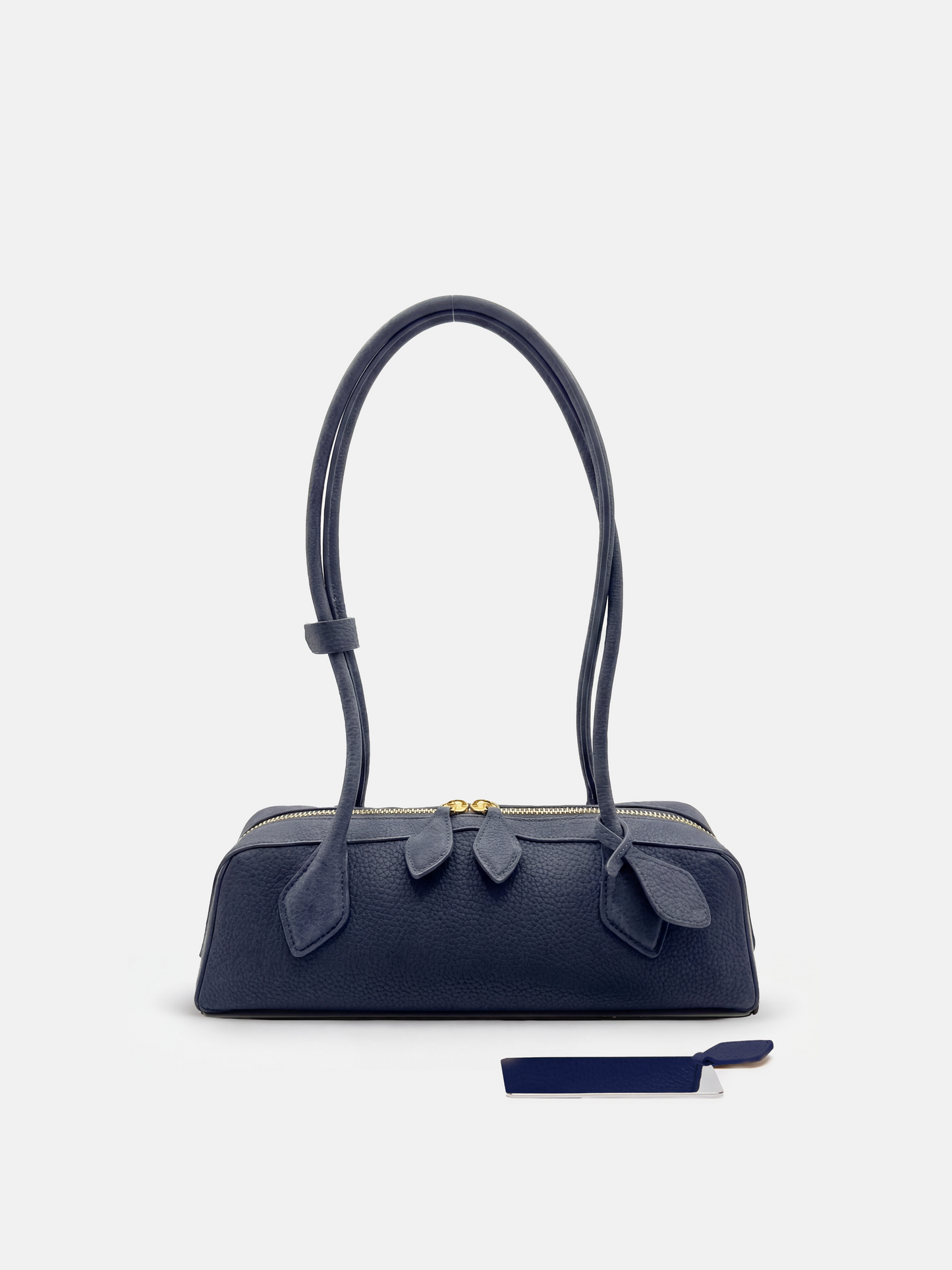 SELVANE Sausage Zipper Shoulder Bag in custom leather, longline, low-profile, softly rounded, with a streamlined zipper top.