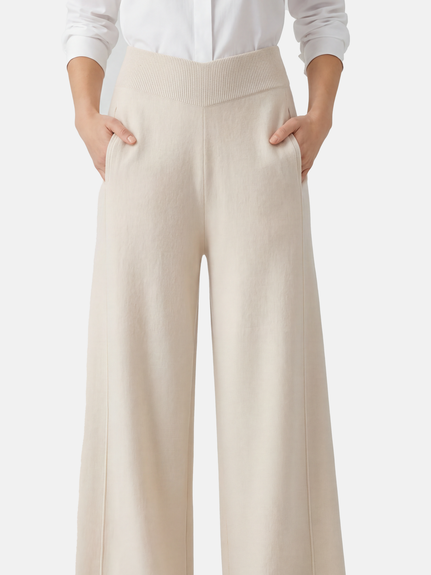 Ivory cashmere wide-leg pants by SELVANE, featuring a soft V-shaped rib waistband and elegant vertical drape.