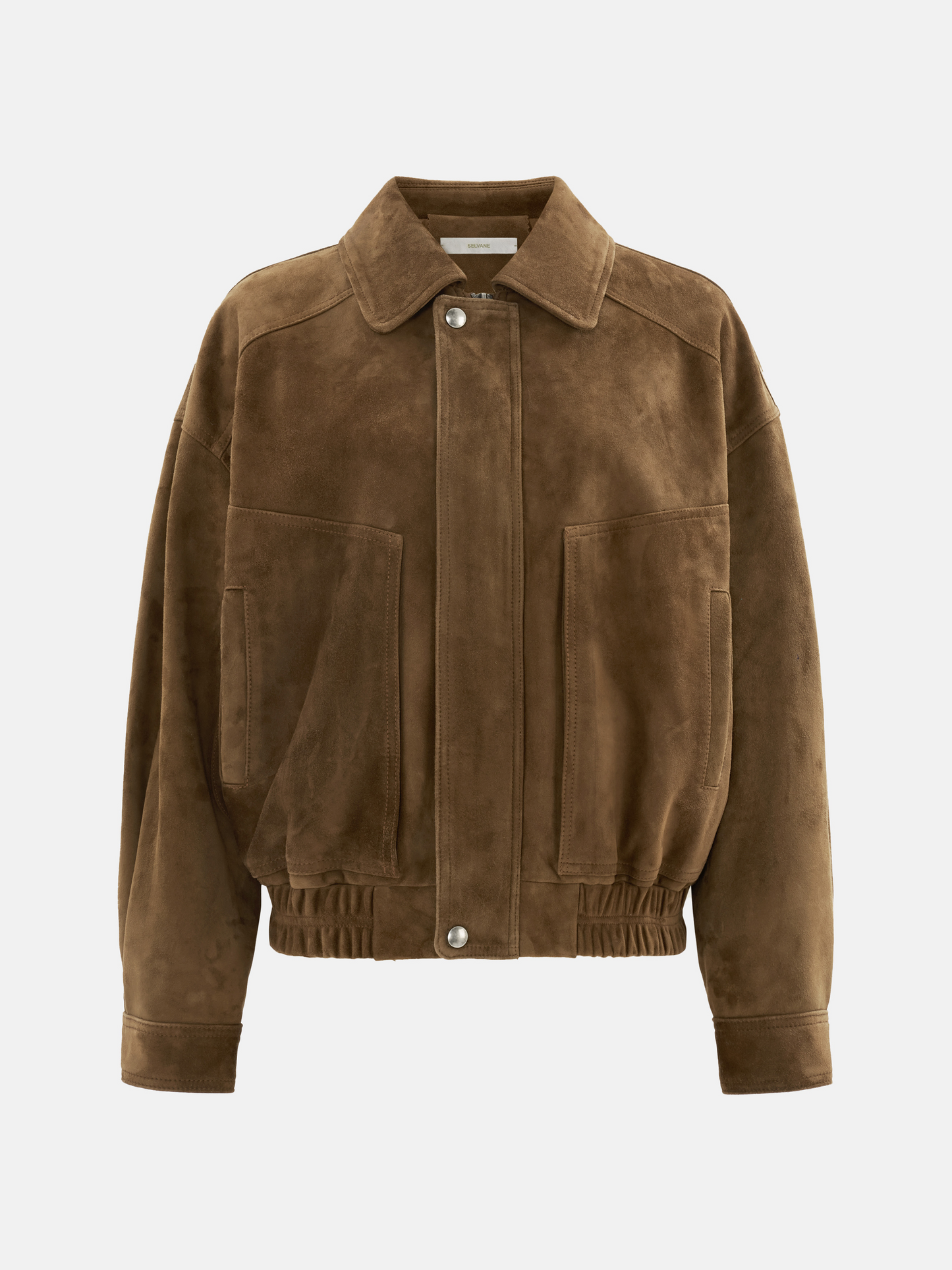 Oversized tan lambskin jacket by SELVANE, featuring a wide pointed collar, ribbed cuffs, and relaxed volume.