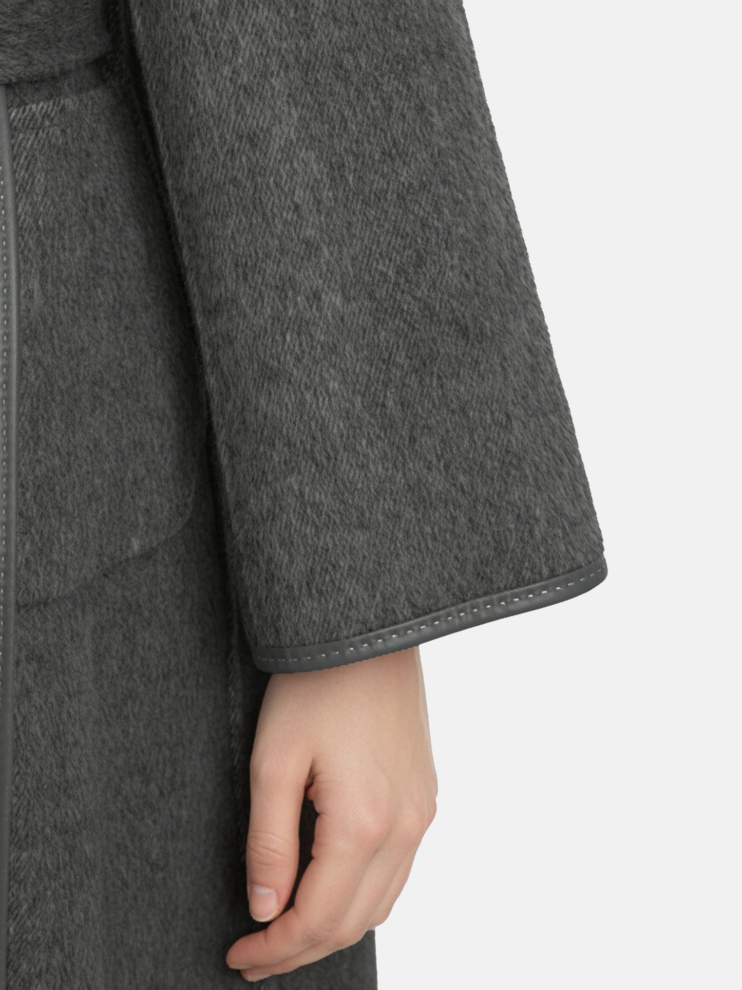 SELVANE Belted Wool Long Coat in a soft wool-llama blend, featuring a fluid drape and clean topstitched edges, worn by a model in a composed stance.