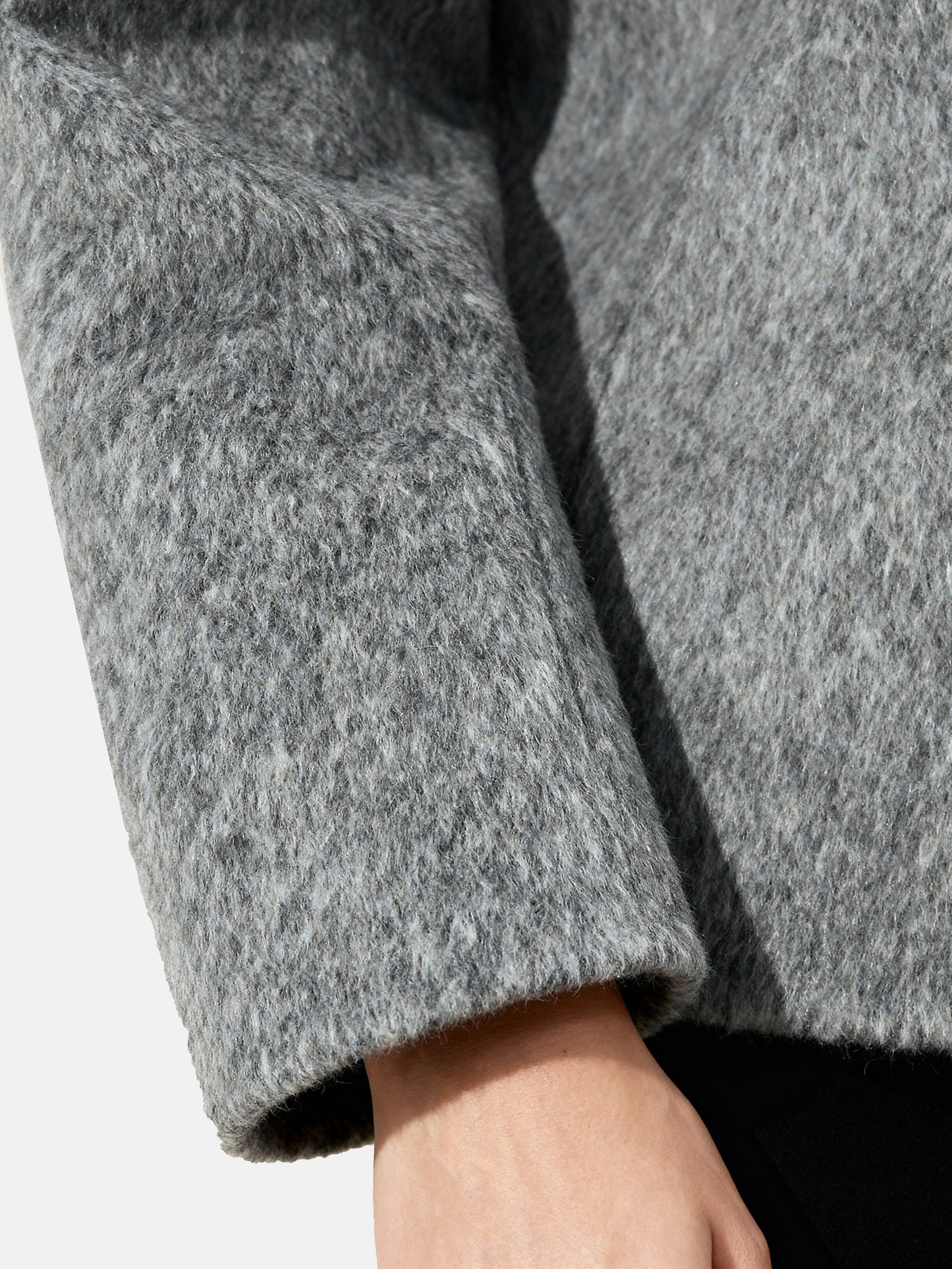 Cropped double-breasted wool-alpaca jacket with integrated scarf collar, styled on a model, front view.