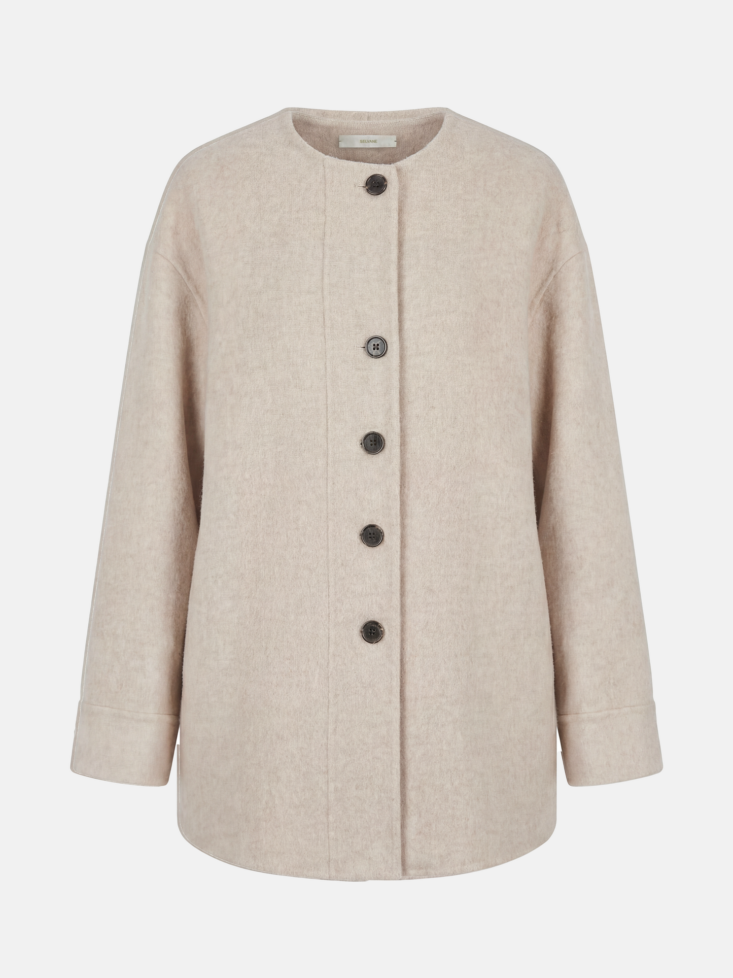 Beige wool and camel hair buttoned coat by SELVANE, featuring a rounded neck and minimal buttons, draped elegantly.