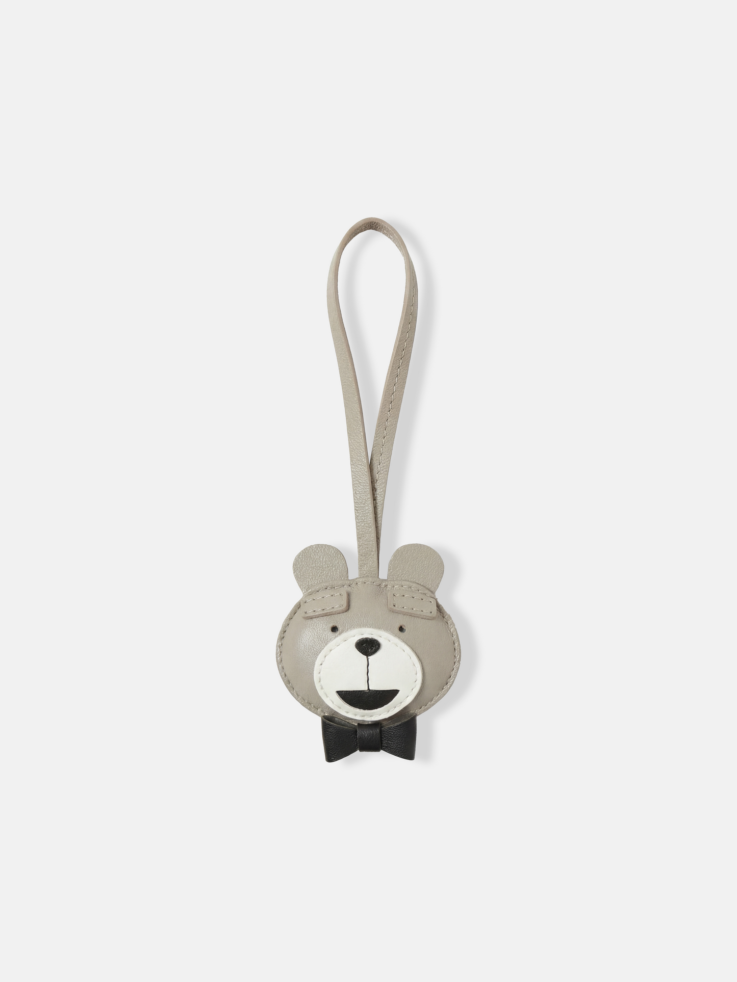 Selvane Bow-Tie Bear Bag Charm in pebbled-leather, featuring a clean bear-face, raised ears, and a neat bow tie, with a slender strap.