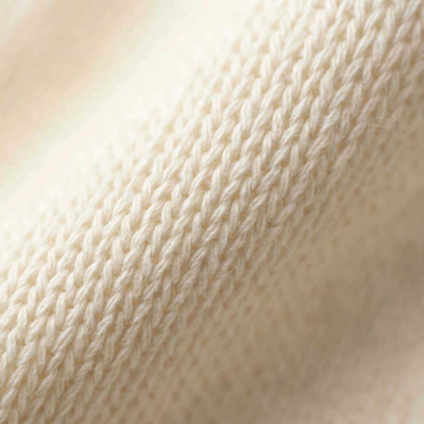 SELVANE warm ivory cowl-neck halter top, featuring architectural drape, semi-sheer fine-gauge knit, and relaxed body-skimming silhouette.