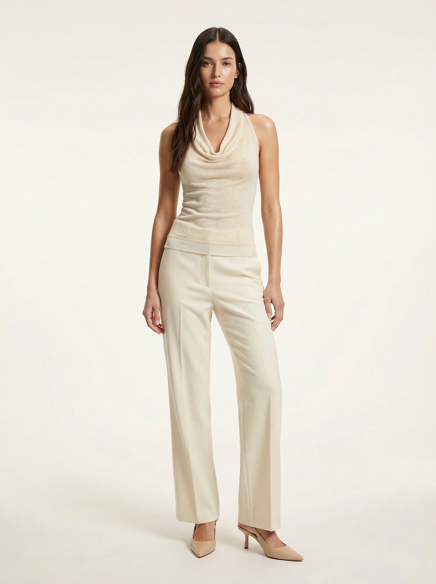 SELVANE warm ivory cowl-neck halter top, featuring architectural drape, semi-sheer fine-gauge knit, and relaxed body-skimming silhouette.