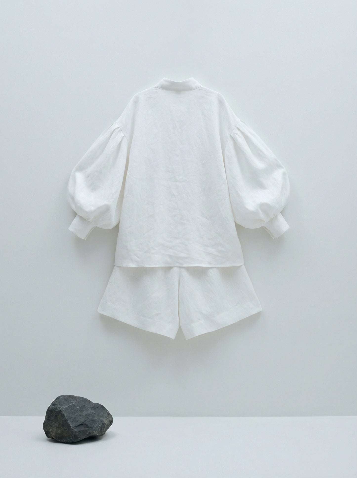 SELVANE white linen-cotton Embroidered Shirt & Shorts Set. Oversized shirt with scattered text, puffed sleeves, French cuffs, matching shorts.