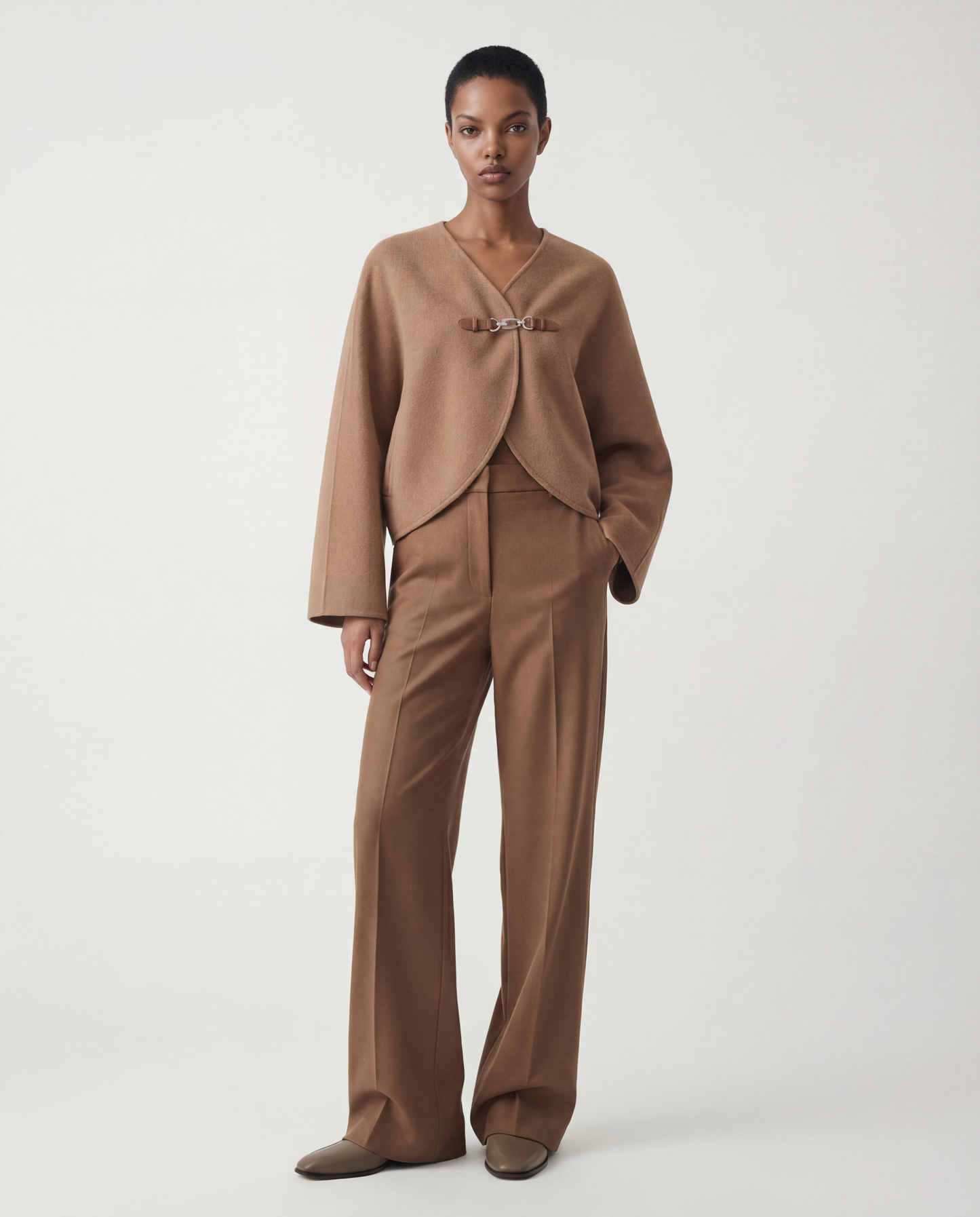 SELVANE Buckled Cape-Style Wool Jacket in khaki, featuring a dramatic cape drape and a single waist buckle.