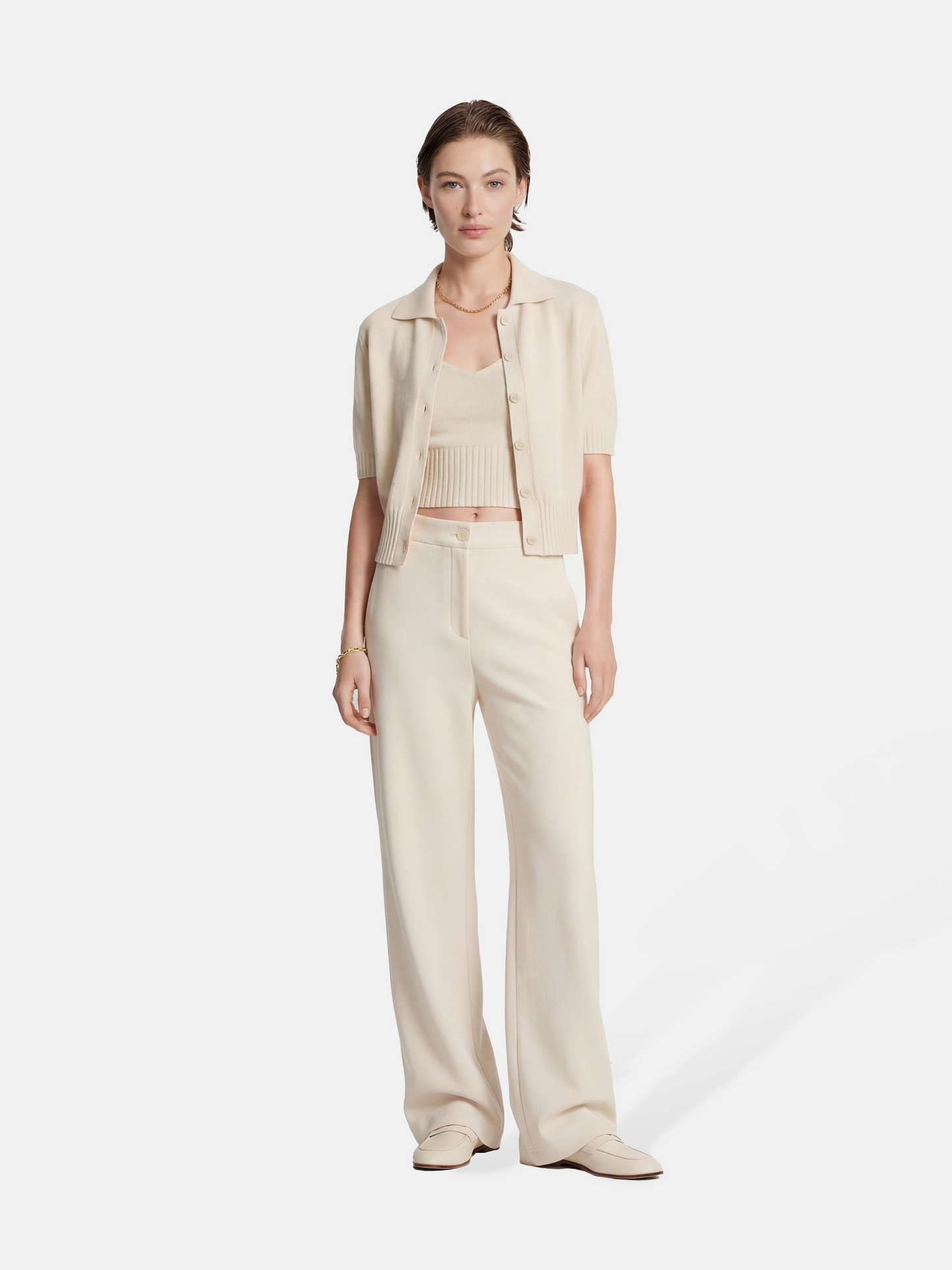 SELVANE Crease-Front Wide-Leg Trousers in a deep hue, showcasing crisp front creases and controlled volume, worn by a model in motion.