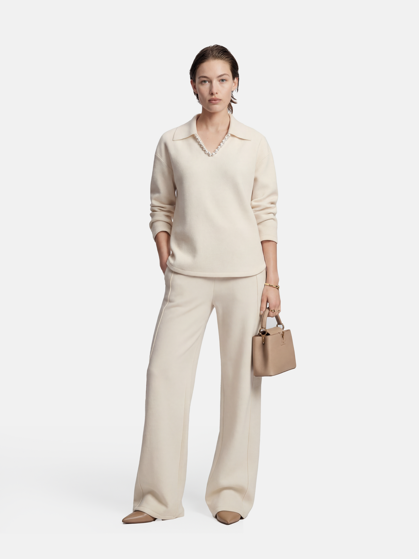 Off-white SELVANE Collared Knit Pullover and Wide-Leg Pants Set, featuring a V-neck and fluid silhouette.