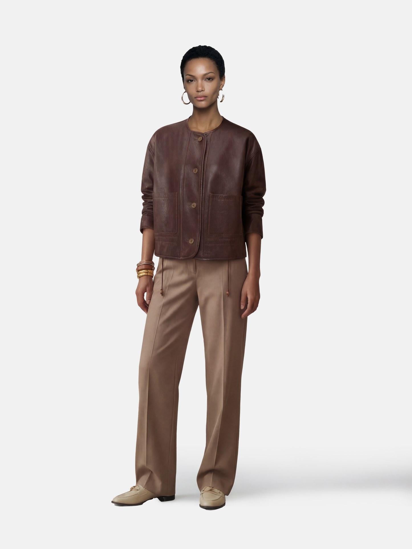 SELVANE brown lambskin crew-neck jacket with softened volume and drawstring hem, showcasing clean lines and supple texture.
