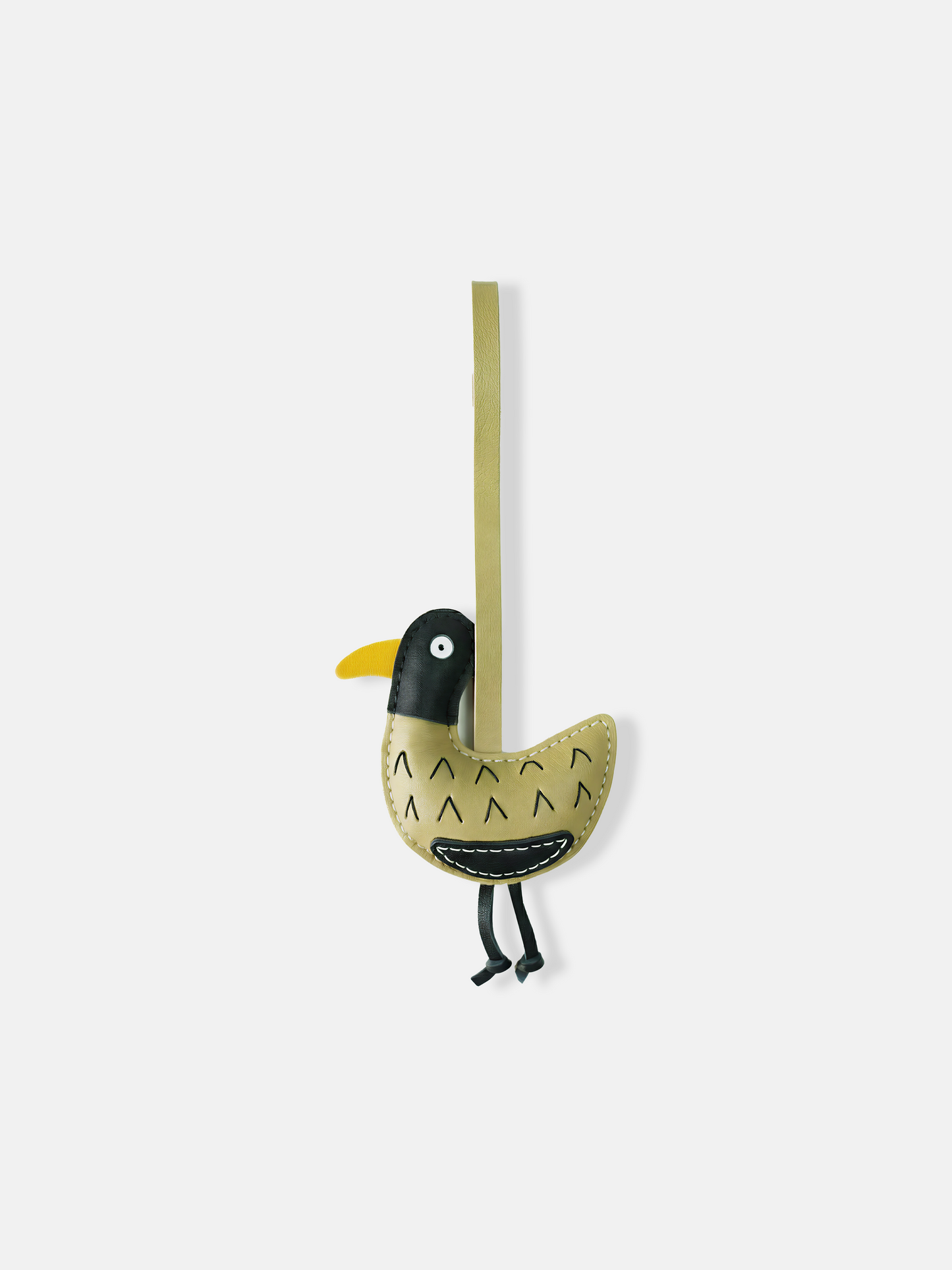 Selvane Little Bird Bag Charm with a long strap, compact yellow bird body, contrast head, curved belly, and slender hanging legs, against a neutral background.