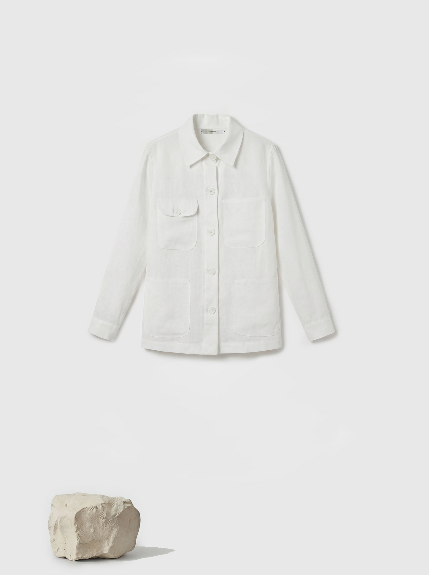 SELVANE Linen Work Shirt Jacket in a natural hue, featuring a clean-lined silhouette and four quiet utility pockets, embodying practical geometry.