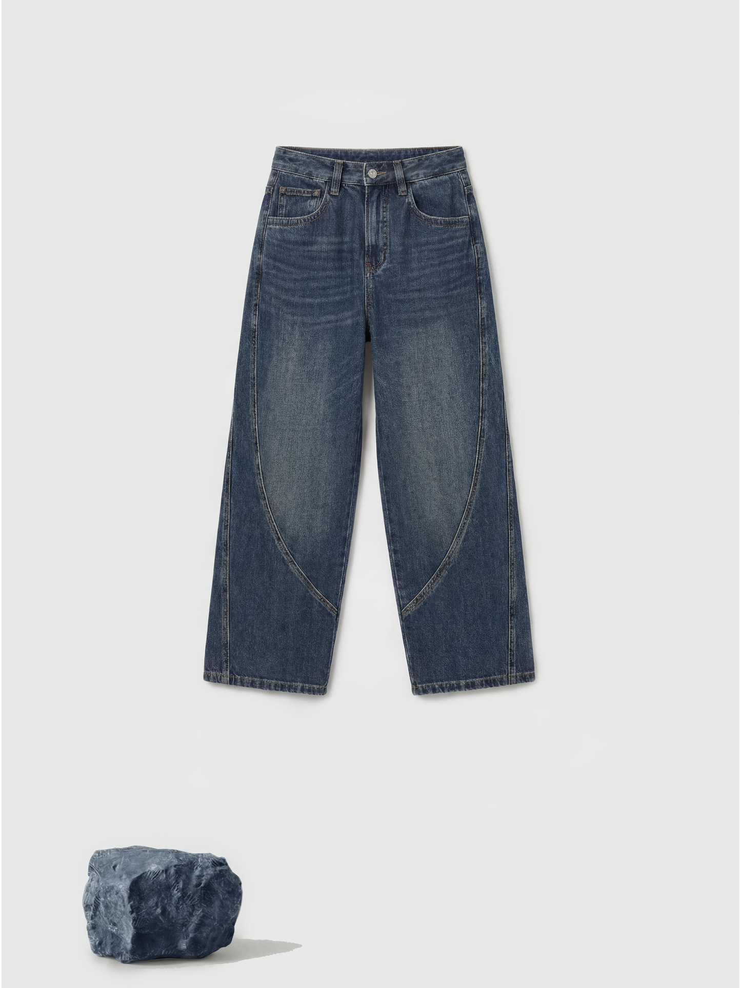 Model wearing high-rise SELVANE Sculpted Seam Wide-Leg Jeans in mid-wash pure cotton denim, showcasing the curved front seams.