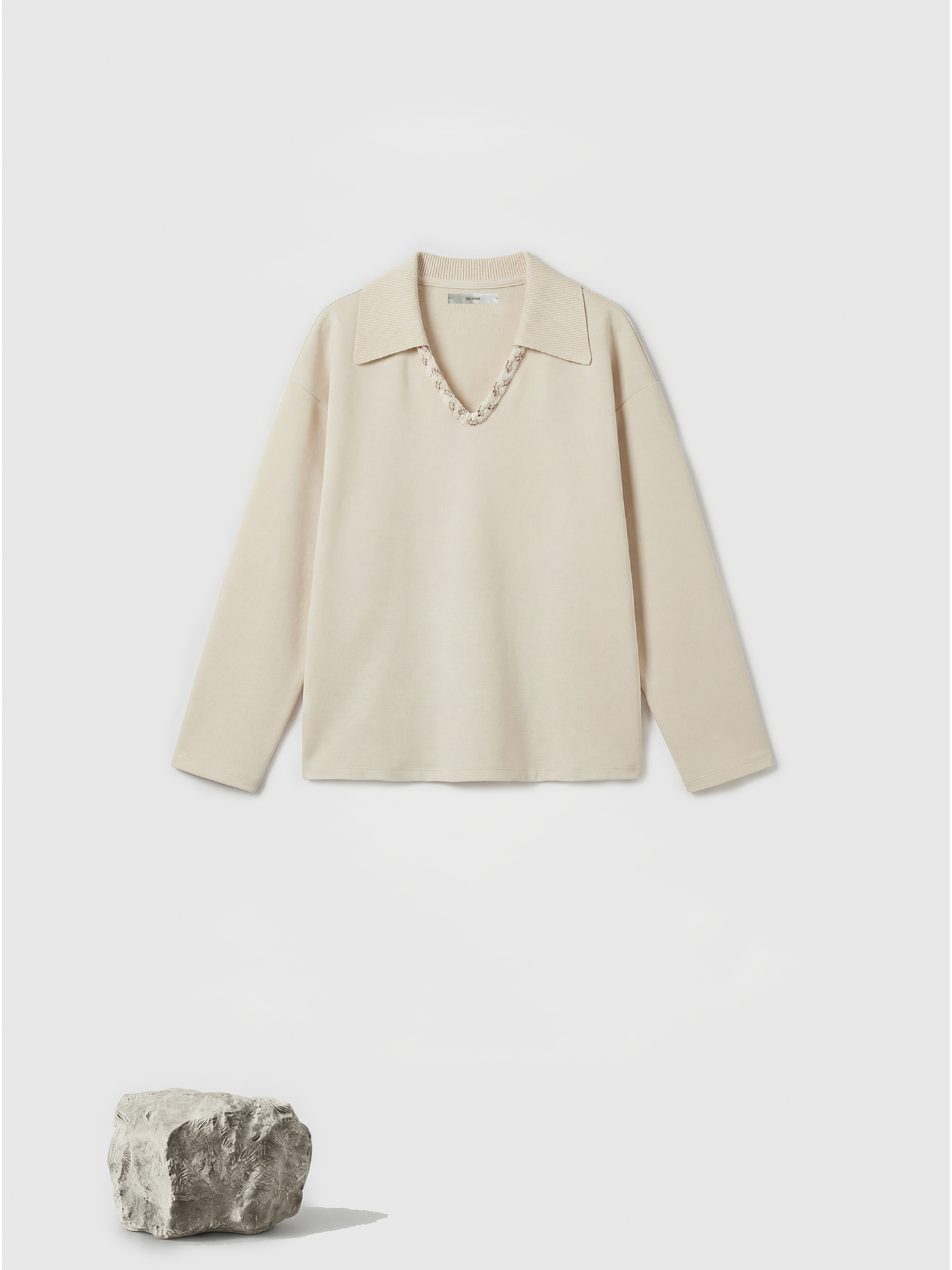 Off-white SELVANE Collared Knit Pullover and Wide-Leg Pants Set, featuring a V-neck and fluid silhouette.