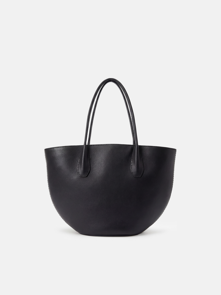 SELVANE Saddle Leather Crescent Tote Bag, featuring clean curvature, a grounded base, and long handles.