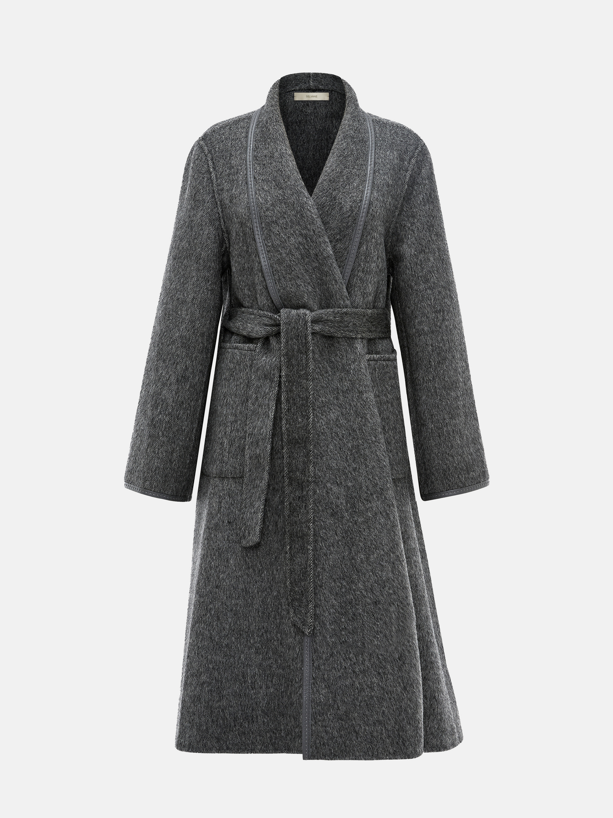 SELVANE Belted Wool Long Coat in a soft wool-llama blend, featuring a fluid drape and clean topstitched edges, worn by a model in a composed stance.