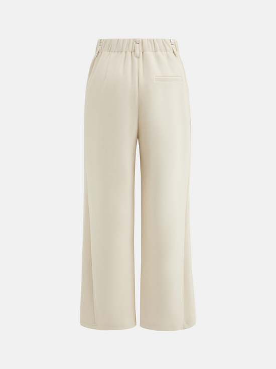 SELVANE Crease-Front Wide-Leg Trousers in a deep hue, showcasing crisp front creases and controlled volume, worn by a model in motion.