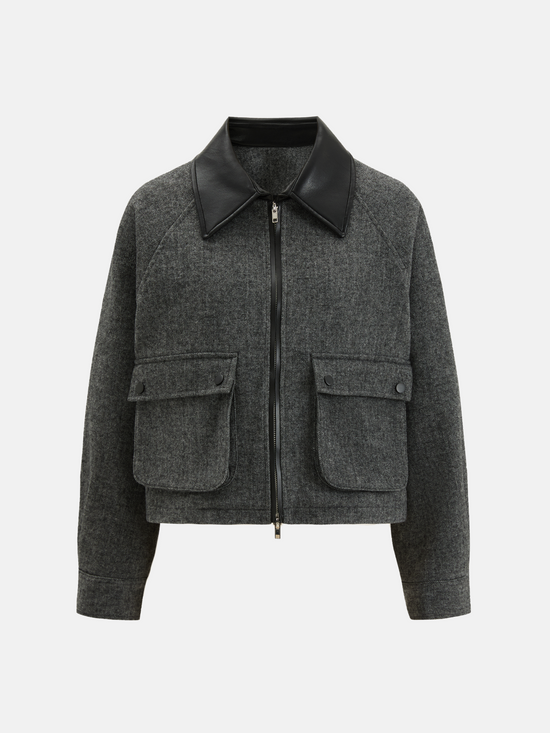 Charcoal wool-blend two-piece set featuring a cropped, boxy jacket with a sharp faux-leather contrast collar and a clean straight skirt.