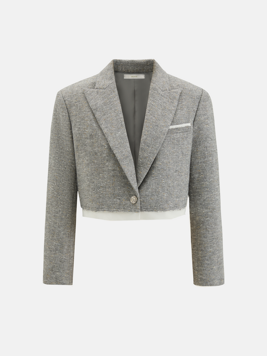 Cropped blazer and wrap midi skirt set in grey, featuring disciplined shoulders and fluid lines, inspired by volcanic terrain.