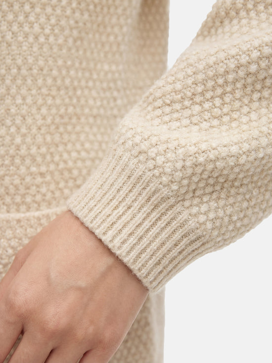 SELVANE Cashmere Textured Henley Sweater in a relaxed fit, featuring a clean round neck, subtle button placket, and visible pebbled texture, designed for calm daily wear.