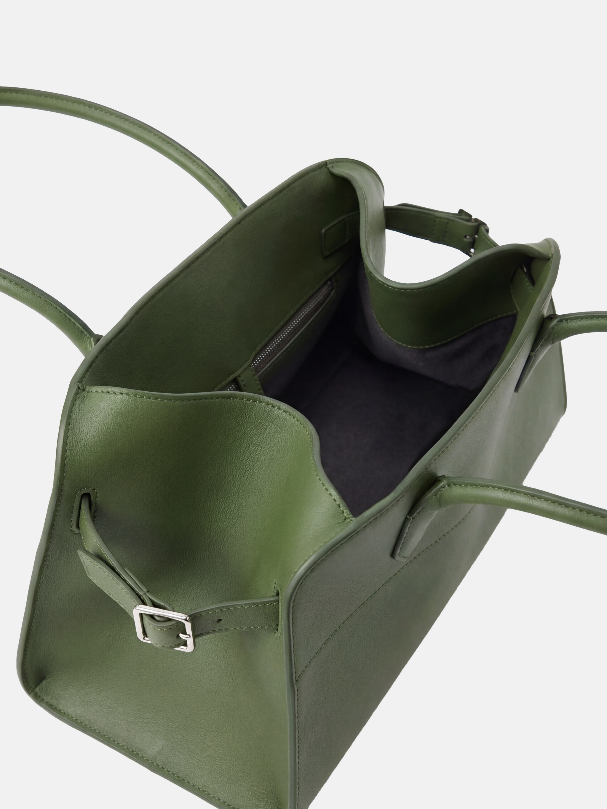 Structured deep navy saddle leather top handle bag with clean curves and elegant trapezoid shape.