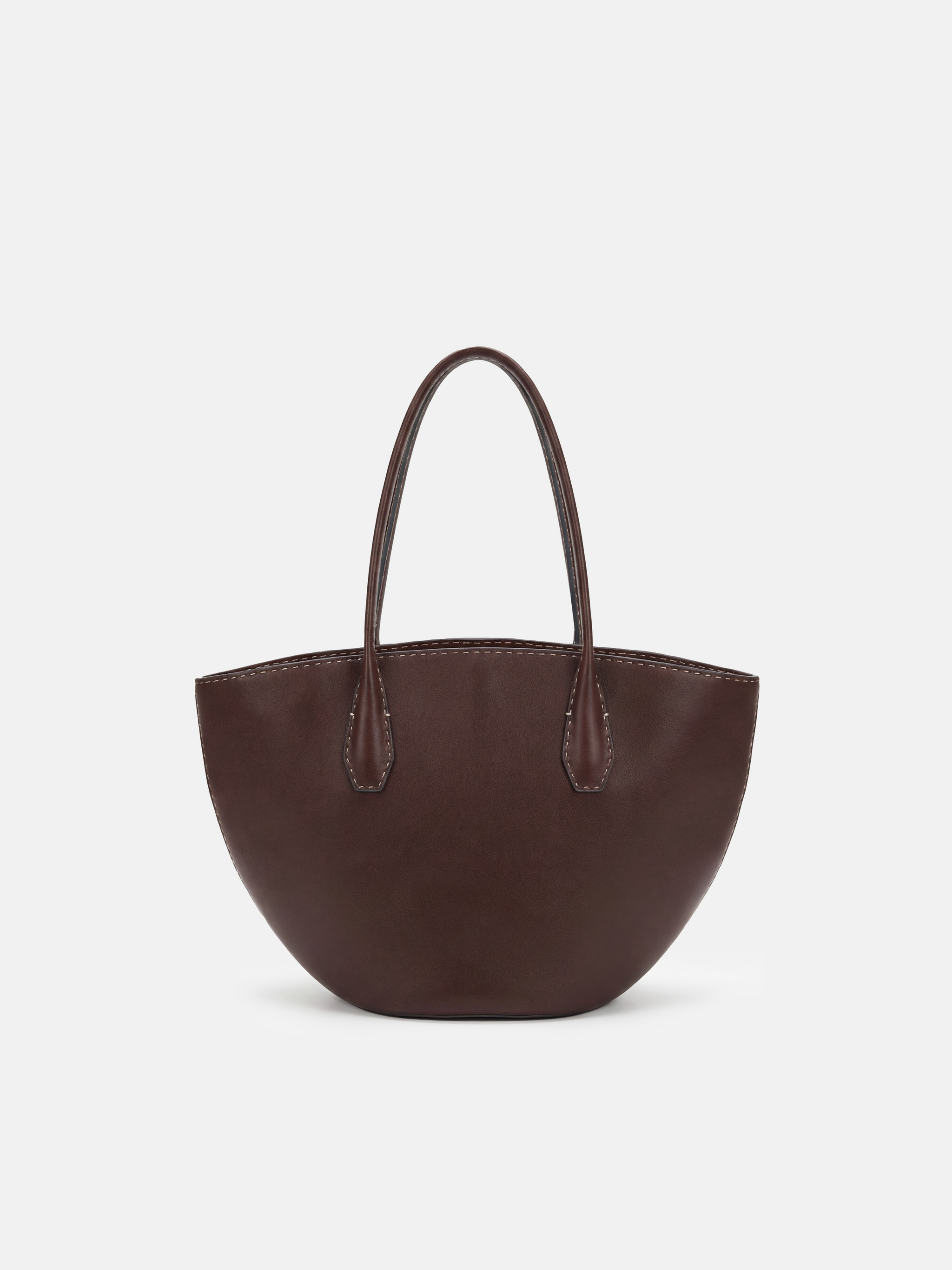 SELVANE Saddle Leather Crescent Tote Bag, featuring clean curvature, a grounded base, and long handles.