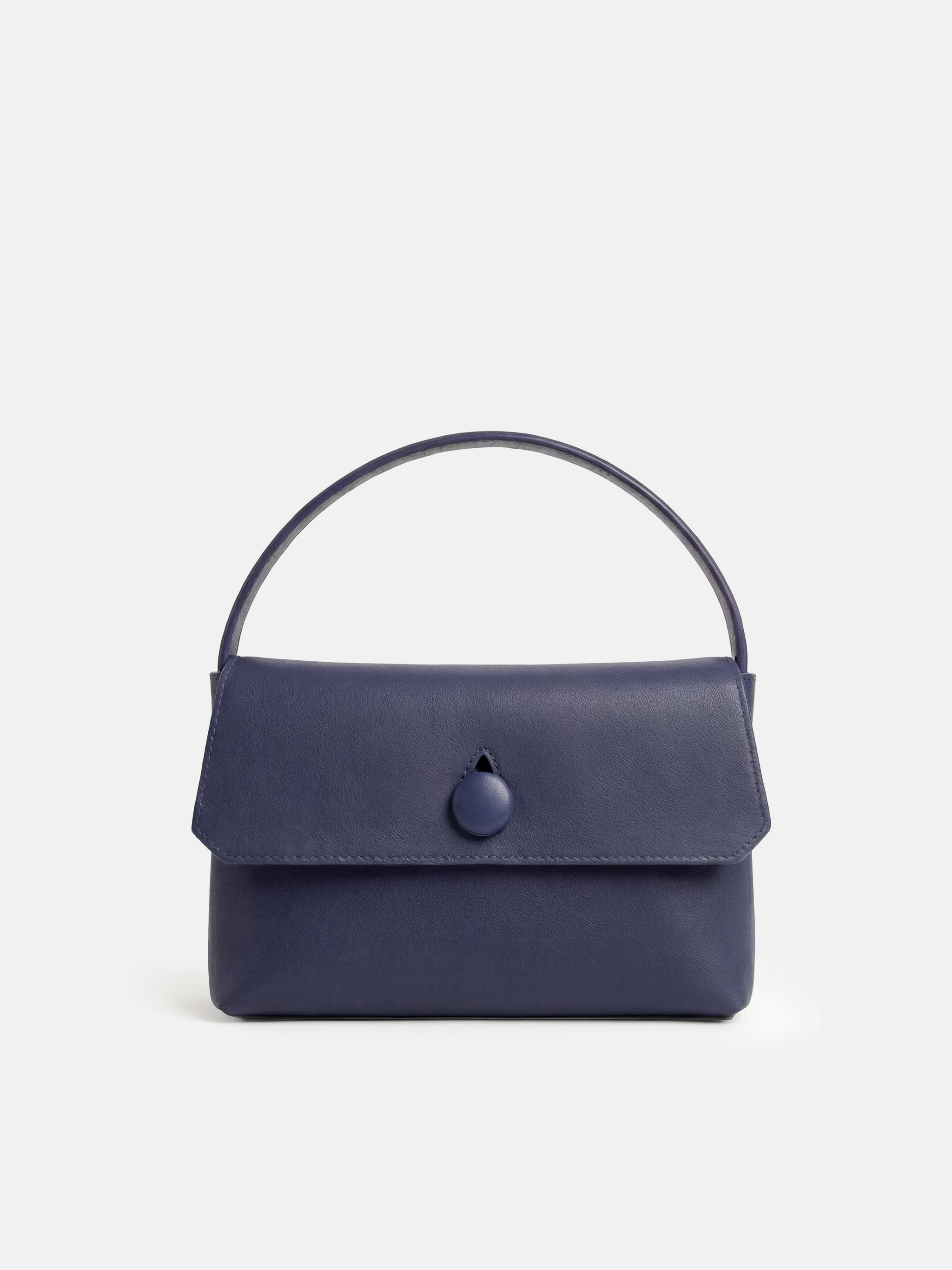 SELVANE Saddle Leather Top-Handle Flap Bag, featuring clean geometry, structured volume, and a precise flap closure.