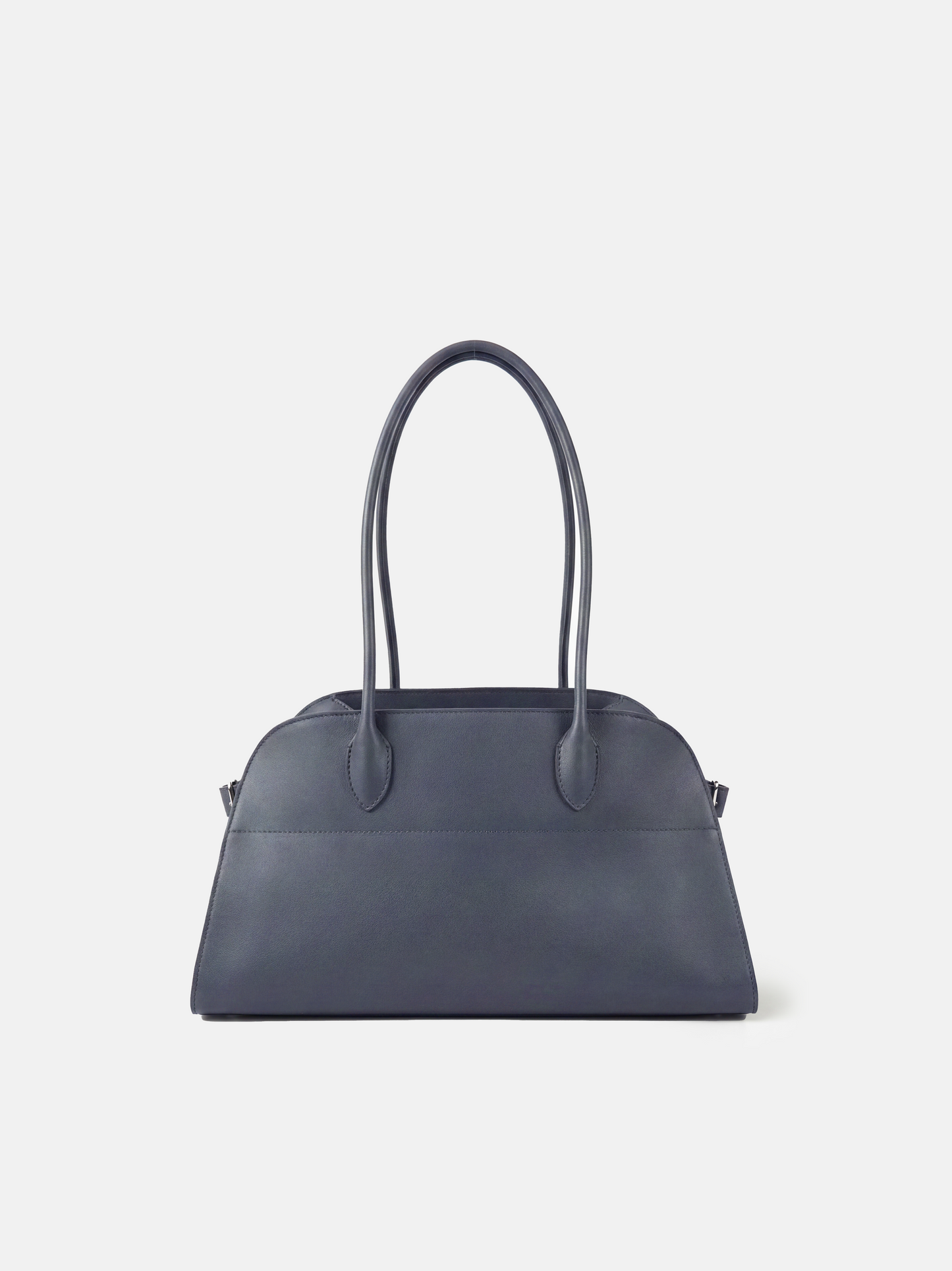 Structured deep navy saddle leather top handle bag with clean curves and elegant trapezoid shape.