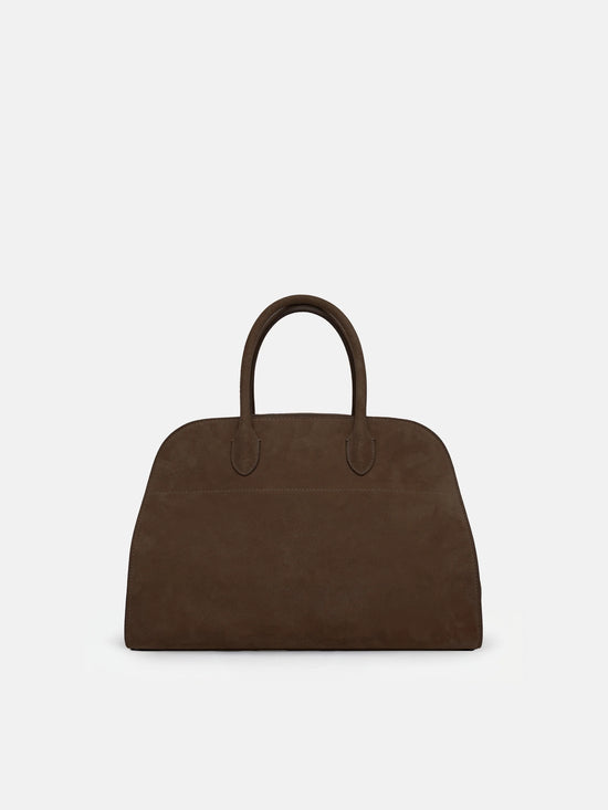 SELVANE Arched Suede Top-Handle Bag, featuring a domed silhouette and velvet-touch surface, presented on a minimalist background.