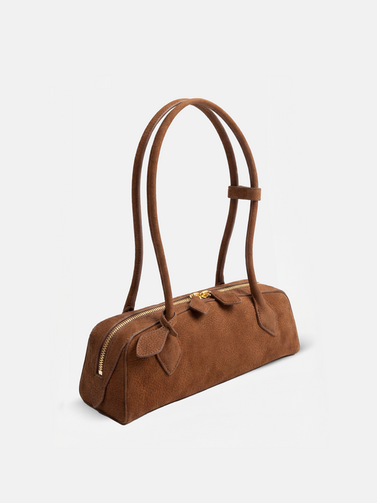 SELVANE Sausage Zipper Shoulder Bag in custom leather, longline, low-profile, softly rounded, with a streamlined zipper top.