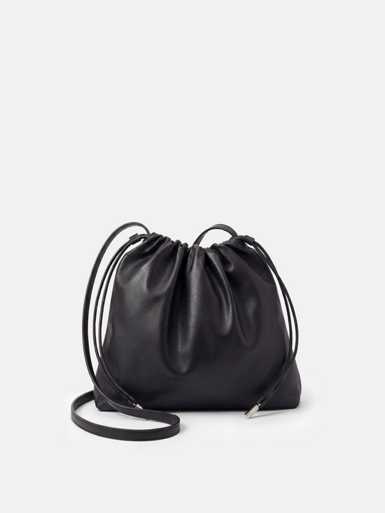 SELVANE soft drawstring pouch bag in a gentle, rounded silhouette with gathered top and secure strap.