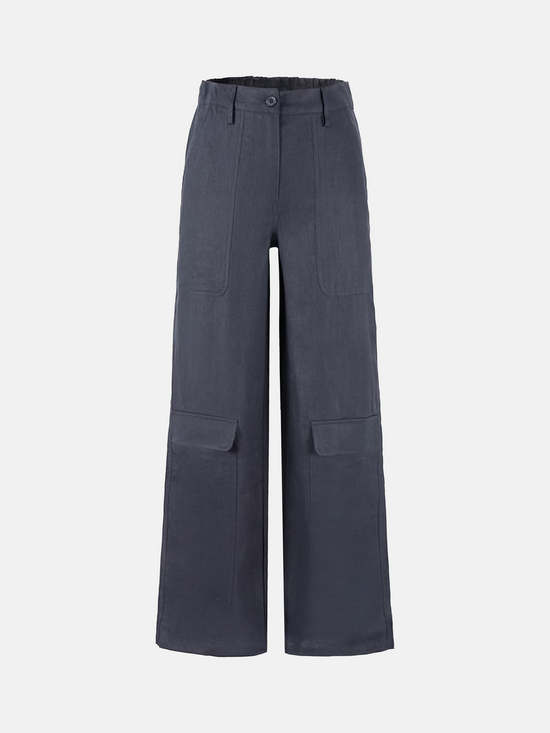 SELVANE Crisp Linen Work Pants, wide and straight cut, subtle utility pockets, on model, highlighting clear vertical lines and composed silhouette.