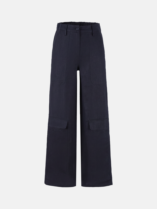 SELVANE Crisp Linen Work Pants, wide and straight cut, subtle utility pockets, on model, highlighting clear vertical lines and composed silhouette.