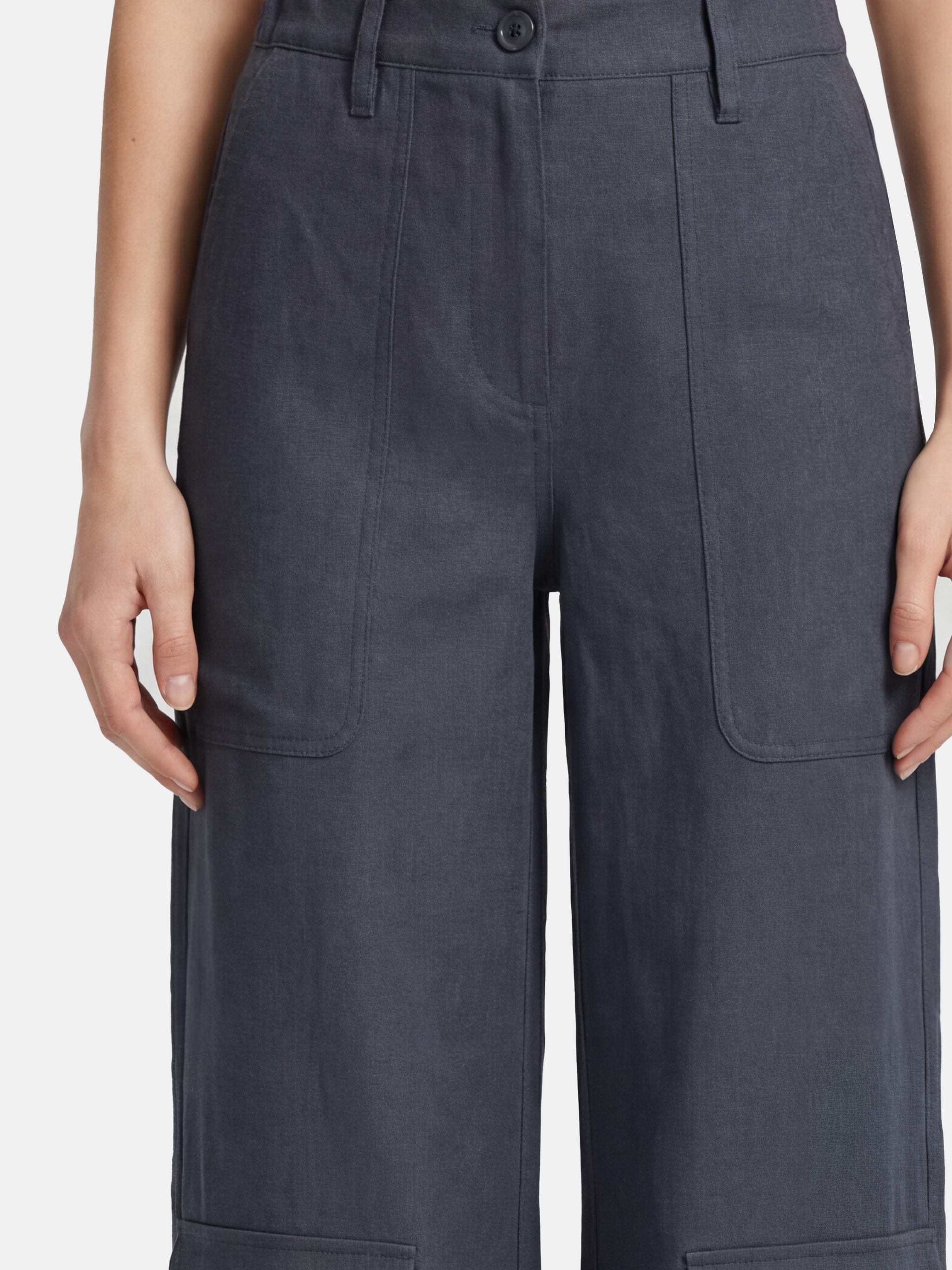 SELVANE Crisp Linen Work Pants, wide and straight cut, subtle utility pockets, on model, highlighting clear vertical lines and composed silhouette.