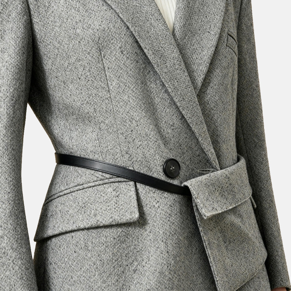 SELVANE heather grey tailored suit set, elongated body, shaped waist with asymmetric belt, on a model.