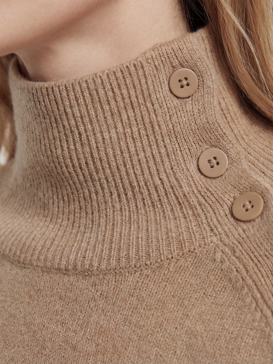 Pure cashmere button-neck cape in warm camel with an elongated, asymmetric drape and high ribbed neck.