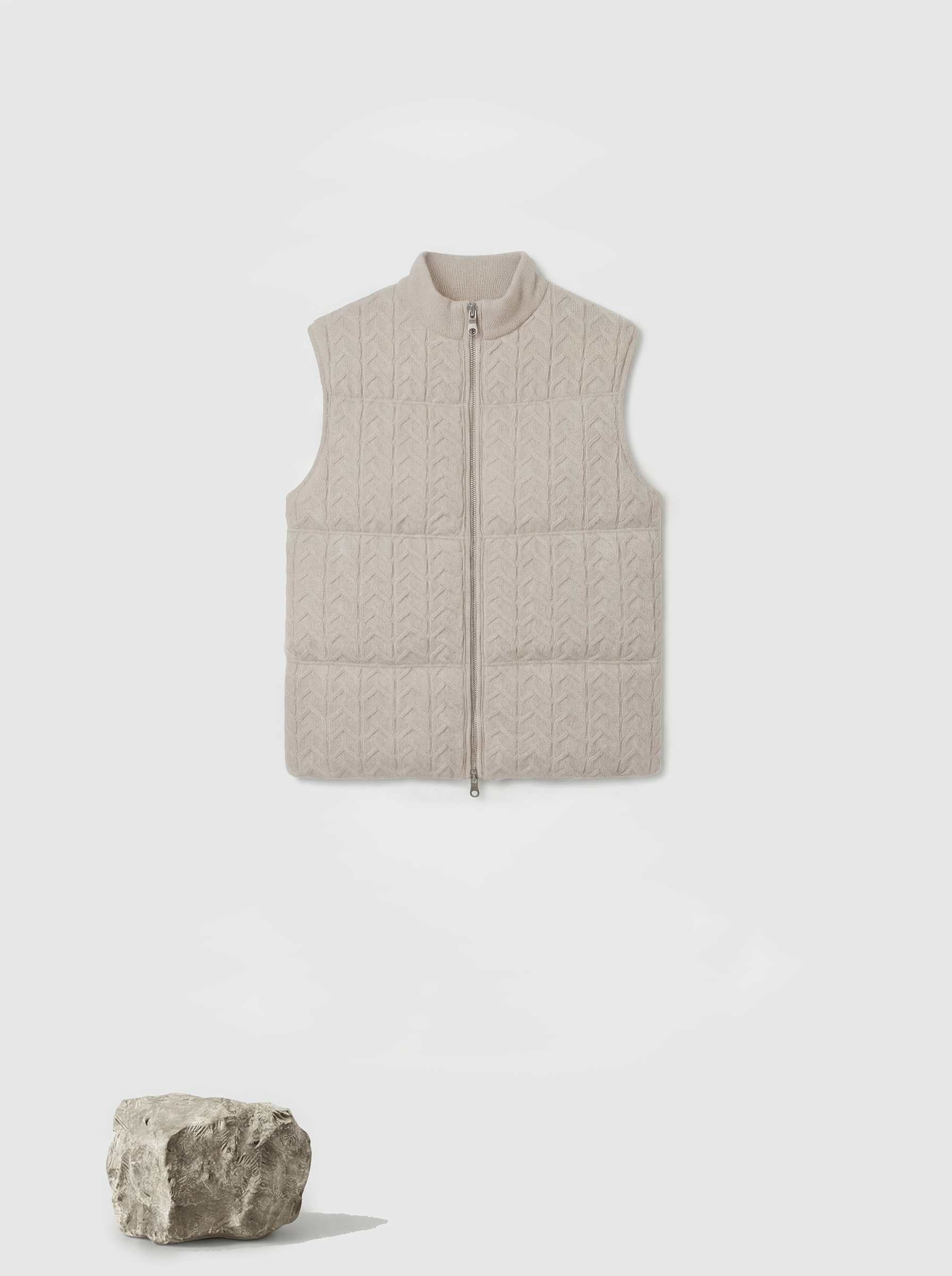 SELVANE zip-front cashmere vest with stand collar and subtle cable texture, shown layered for crisp silhouette.
