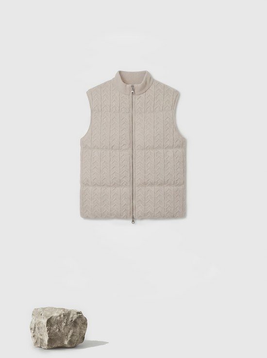 SELVANE zip-front cashmere vest with stand collar and subtle cable texture, shown layered for crisp silhouette.
