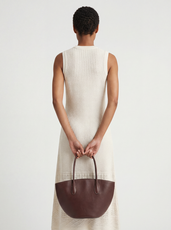 SELVANE Saddle Leather Crescent Tote Bag, featuring clean curvature, a grounded base, and long handles.