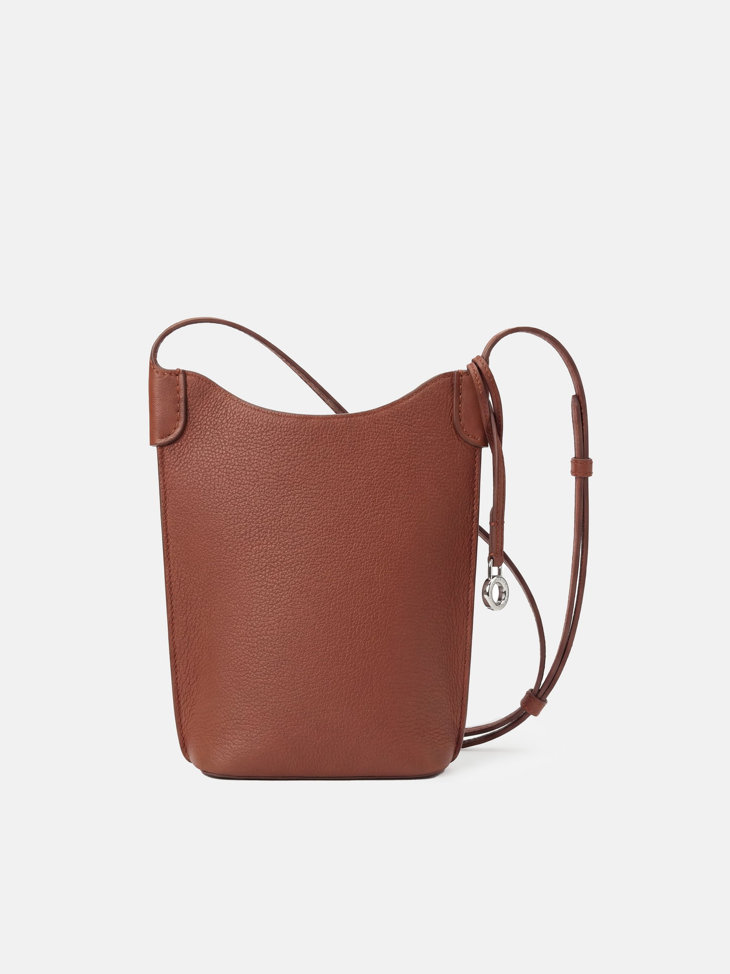 SELVANE Leather Mini Bucket Bag in Bonaudo cow leather, featuring soft vertical lines, a curved top, and long strap, sitting neatly.
