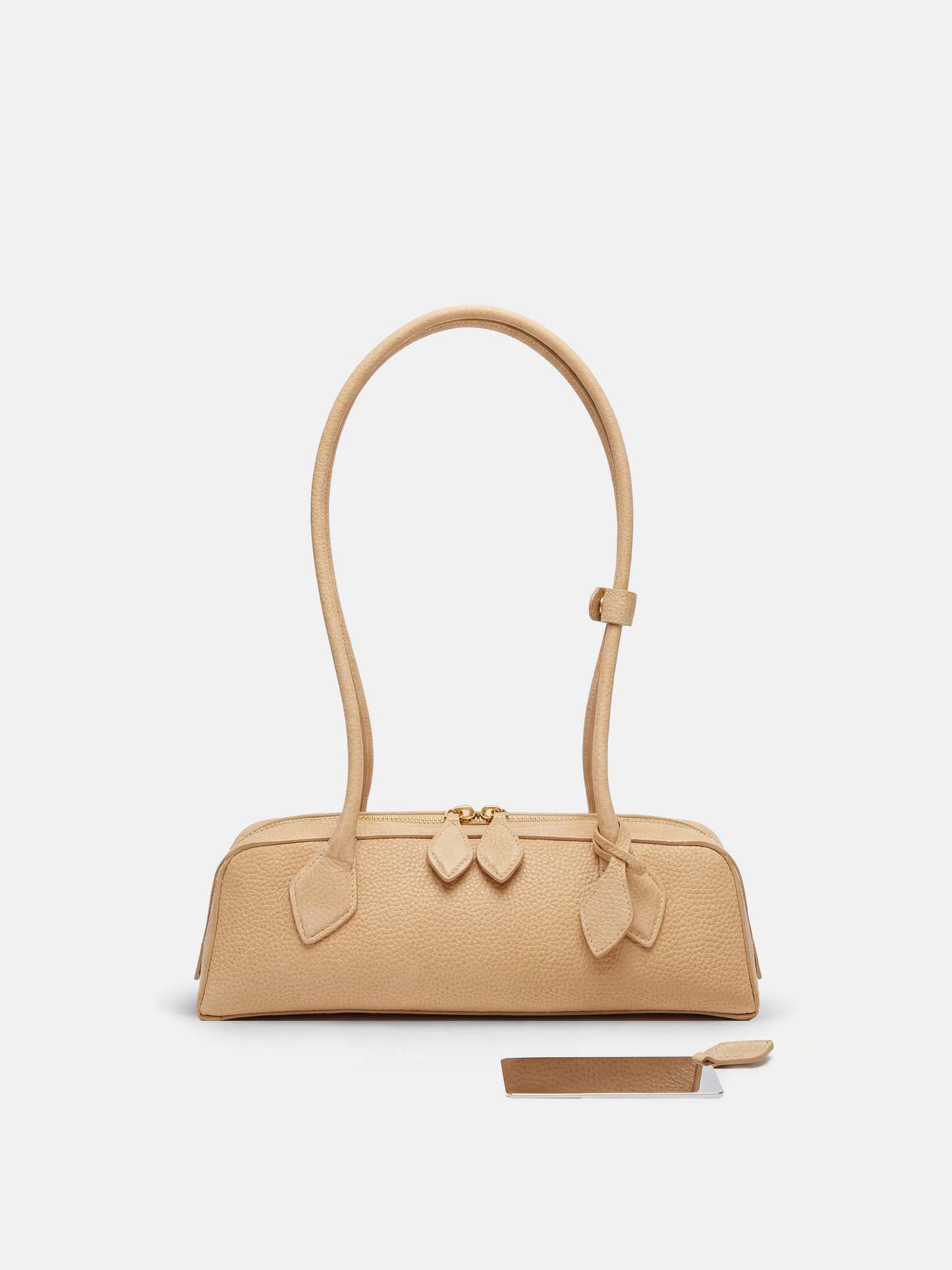 SELVANE Sausage Zipper Shoulder Bag in custom leather, longline, low-profile, softly rounded, with a streamlined zipper top.